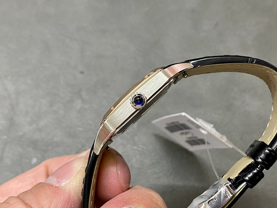 Cartier watch with rose gold-tone case and black leather strap, side profile view