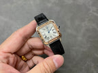 Cartier watch with black leather strap and rose gold-tone square case, front view