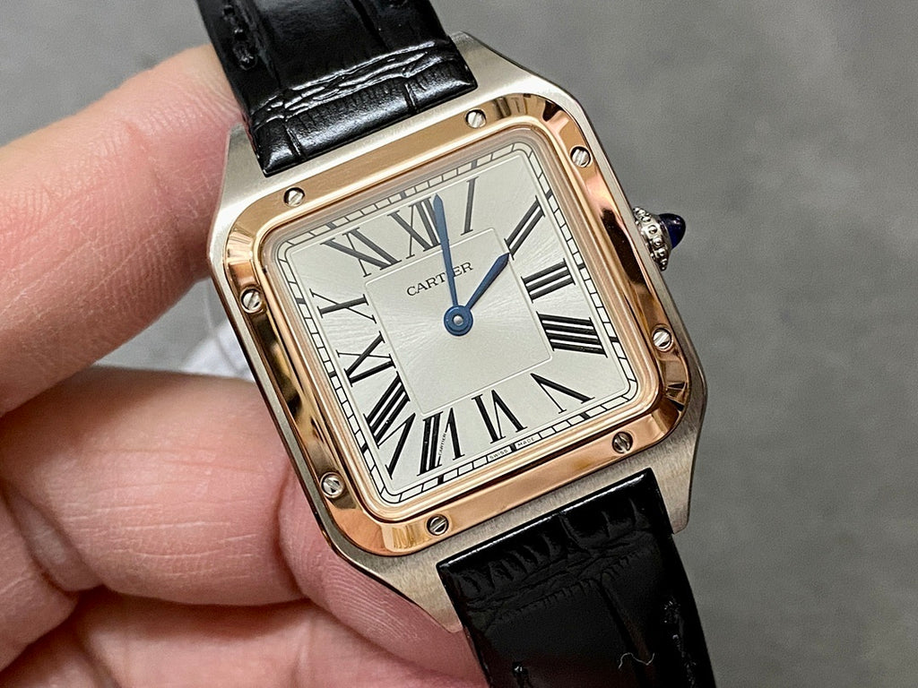 Cartier watch close-up with black leather strap, rose gold-tone square case, silver dial