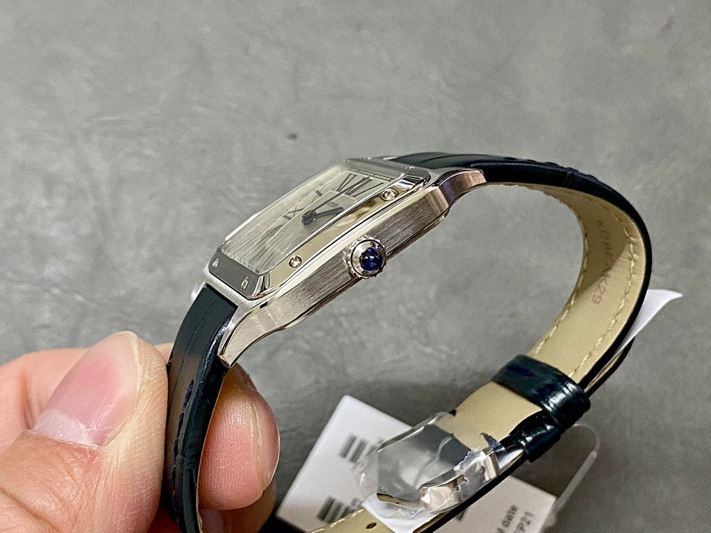 Cartier wristwatch side view with black leather strap and round crown