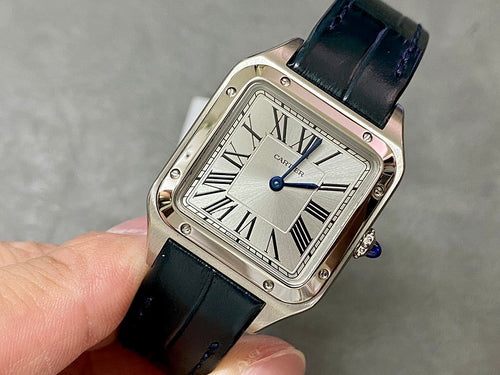 Cartier wristwatch with rectangular silver case, blue dial, black leather strap