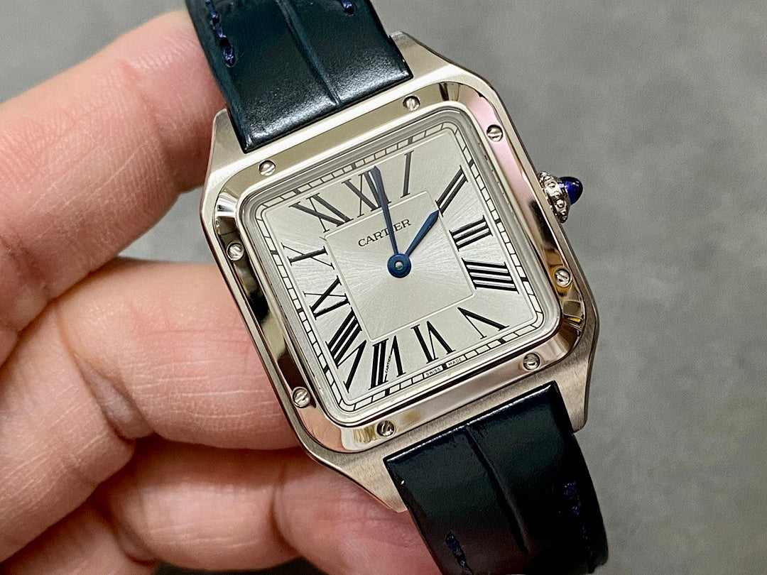 Cartier wristwatch front view with white dial, black leather strap, Roman numerals