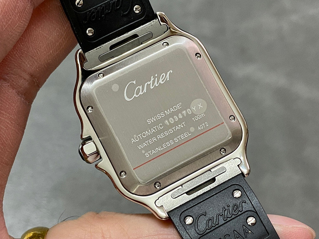 Cartier wristwatch caseback with Swiss made, automatic, water resistant, stainless steel text