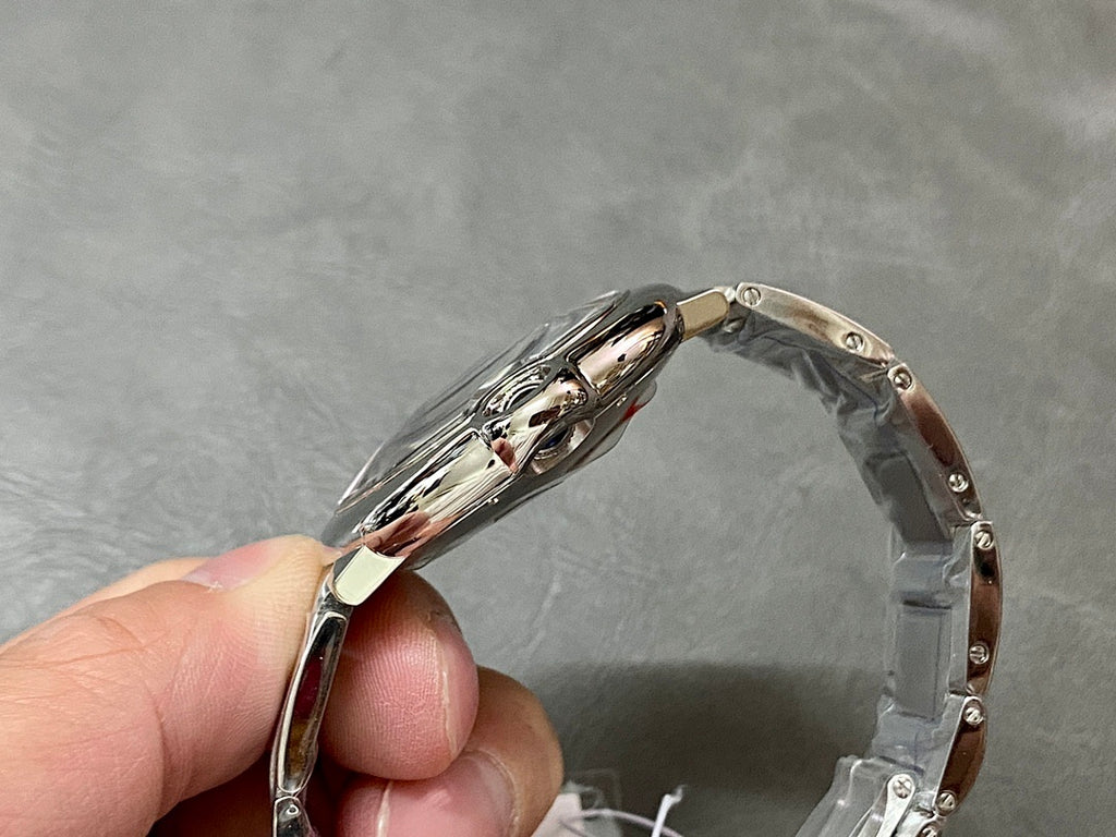 Cartier steel watch case profile, polished edges and lugs