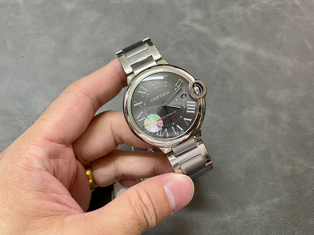 Cartier automatic wristwatch, black dial with Roman numerals, steel bracelet