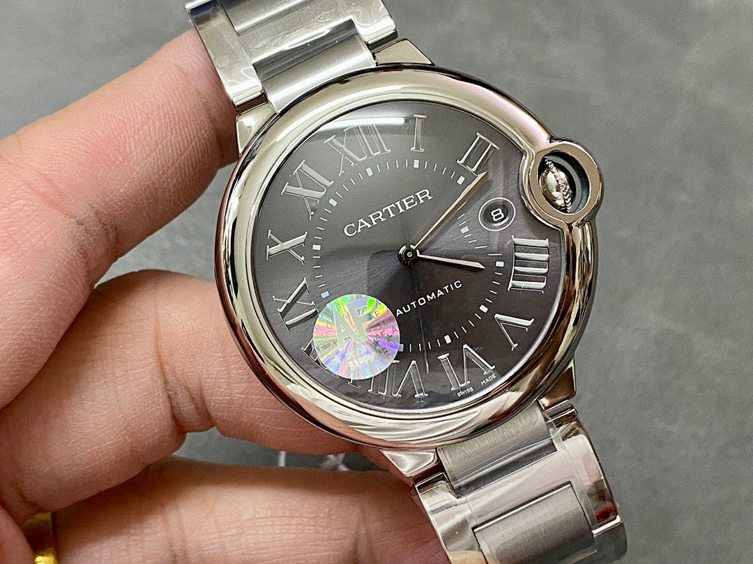 Cartier automatic wristwatch, black dial, Roman numerals, steel case and bracelet