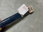 Blue leather strap with gold buckle and connector clasp on Cartier watch