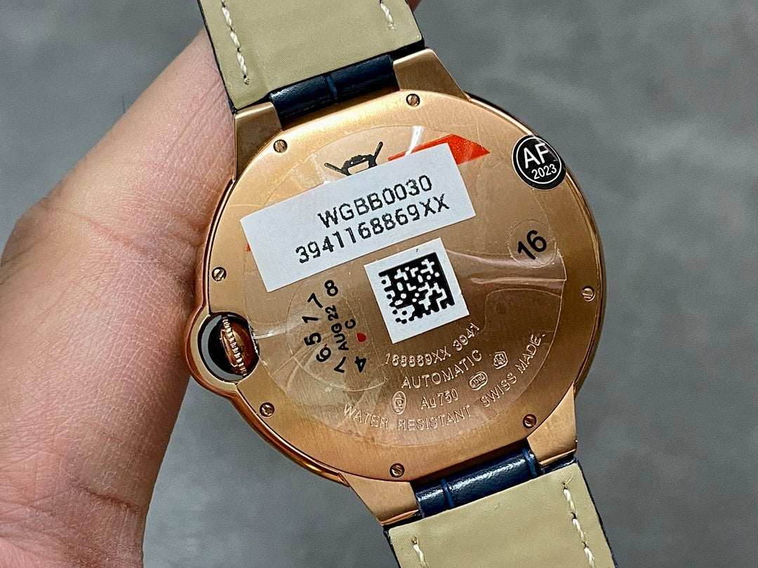 Cartier watch caseback in gold with serial label and QR code, blue leather strap