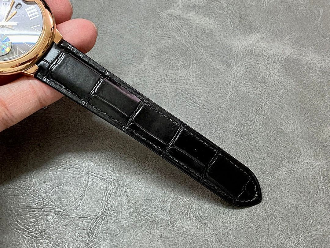 Cartier watch black leather strap, flat close-up of strap and buckle end