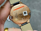 Cartier watch case back in rose gold, black strap, engraved details and logo