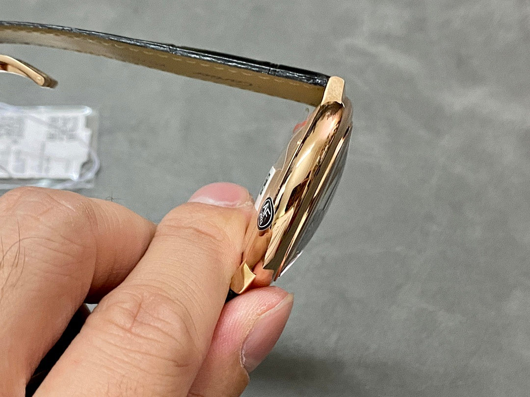 Cartier watch profile close-up, rose-gold case edge and crown details