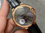 Cartier watch close-up, rose-gold case, dark dial with Roman numerals and gem