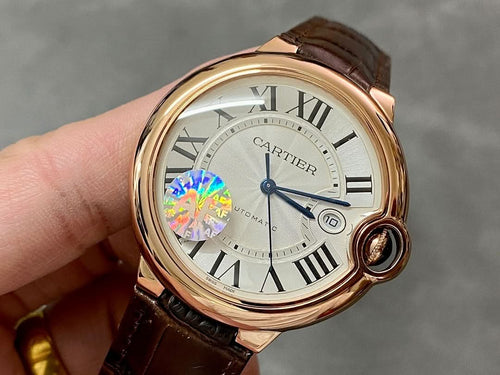 Cartier watch with rose-gold case, white dial, Roman numerals, brown leather strap