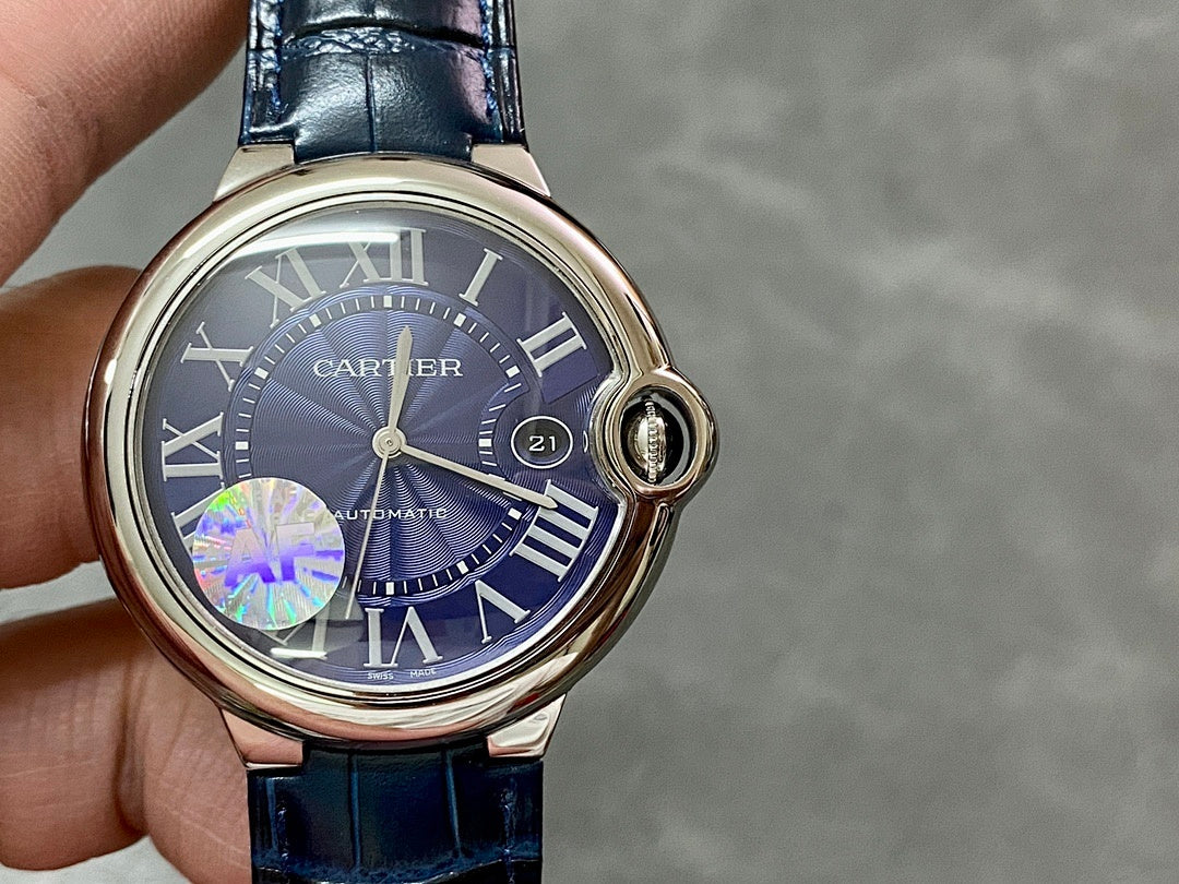 Cartier round wristwatch front with blue dial, Roman numerals, and blue leather strap