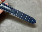 Blue leather watch strap with stitched edges, crocodile-style pattern