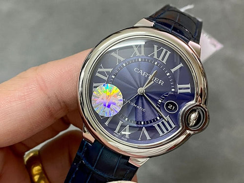 Cartier round wristwatch with blue dial, Roman numerals, and blue leather strap