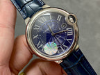 Cartier watch dial close-up with blue background, Roman numerals, and gold hands