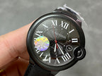 Cartier wristwatch with black dial, Roman numerals, date window 16, black fabric strap