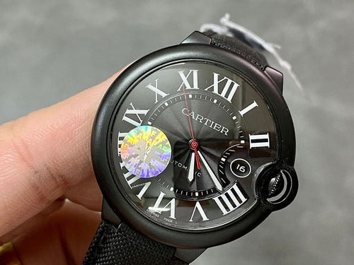 Cartier wristwatch with black dial, Roman numerals, date window 16, black fabric strap