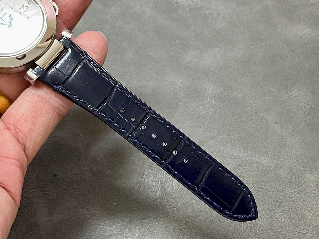 Cartier wristwatch dark blue leather strap underside with metal clasp hardware.