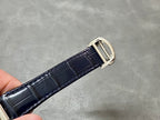 Cartier wristwatch leather strap with silver buckle and stitching detail.