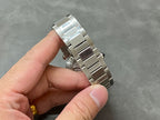 Cartier watch silver metal bracelet, side view of case and clasp