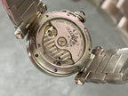 Cartier watch caseback with exposed mechanical dial and engraved markings