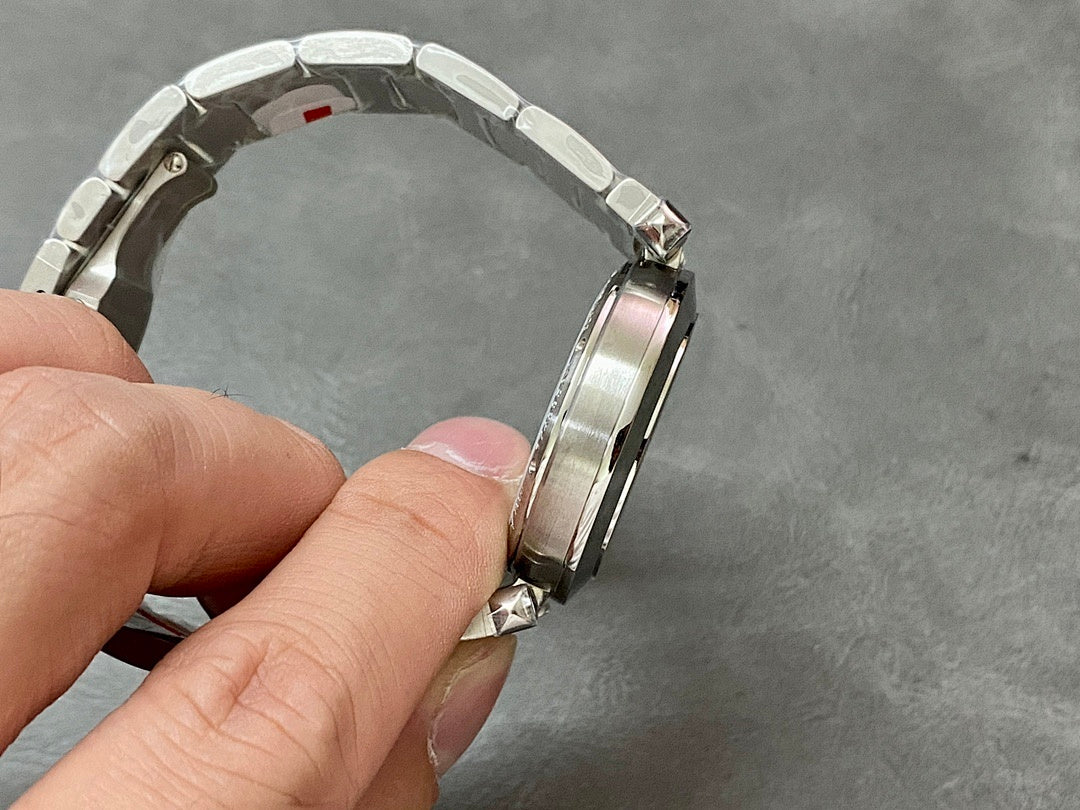 Cartier watch silver metal bracelet from side angle, clasp and links visible
