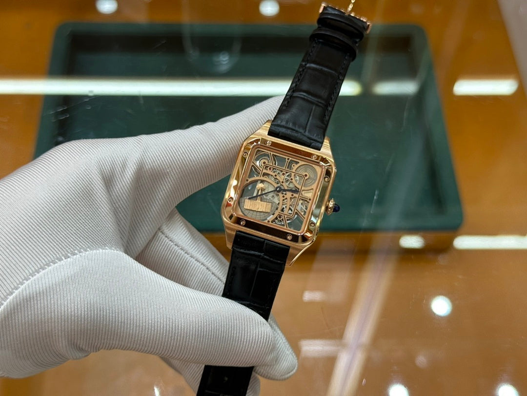 Gold-tone square wristwatch with black leather strap and patterned dial