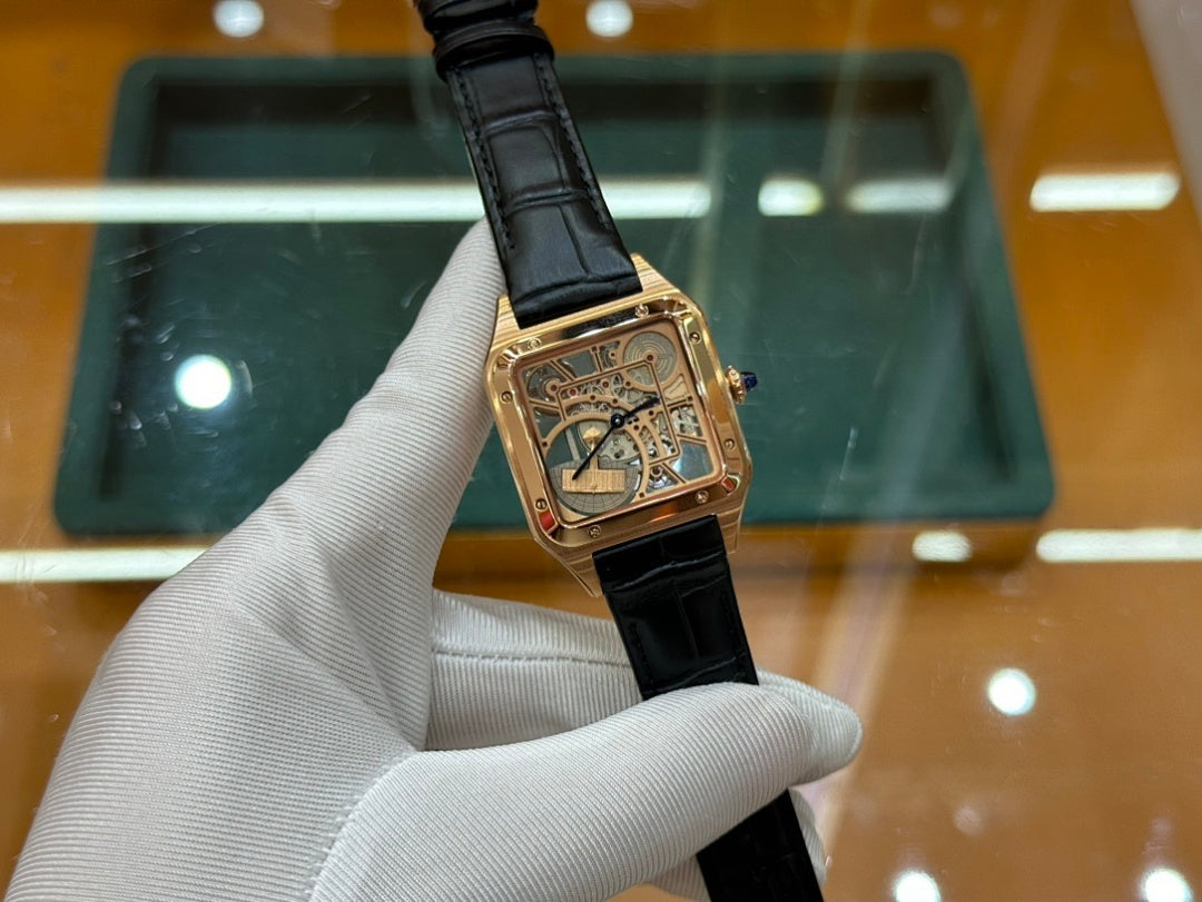 Gold-tone square wristwatch with black leather strap, blue-gold dial face