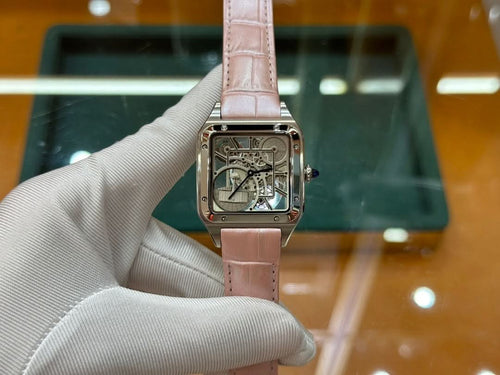 Cartier watch with light pink leather strap and square silver case, visible mechanical dial