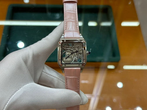 Cartier watch with light pink leather strap and square silver case, front view with skeleton dial