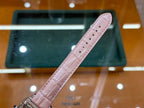 Cartier watch strap with light pink leather band, perforations, and silver clasp end piece