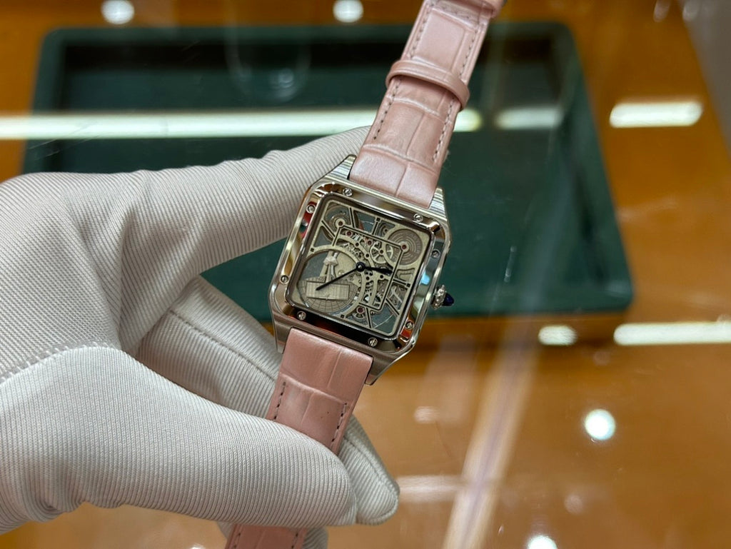 Cartier watch with light pink leather strap and square silver case, front view with ornate dial