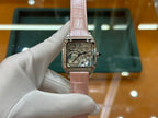 Cartier watch with light pink leather strap and square silver case, front view of mechanical face