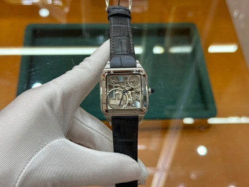 Rectangular skeleton dial watch with black leather strap, front view