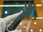 Black leather watch strap with stitched edge and row of eyelets