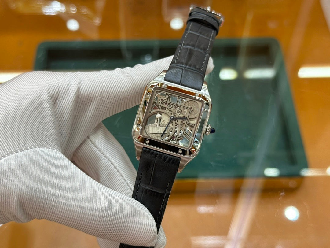 Rectangular skeleton dial wristwatch on black leather strap, front view