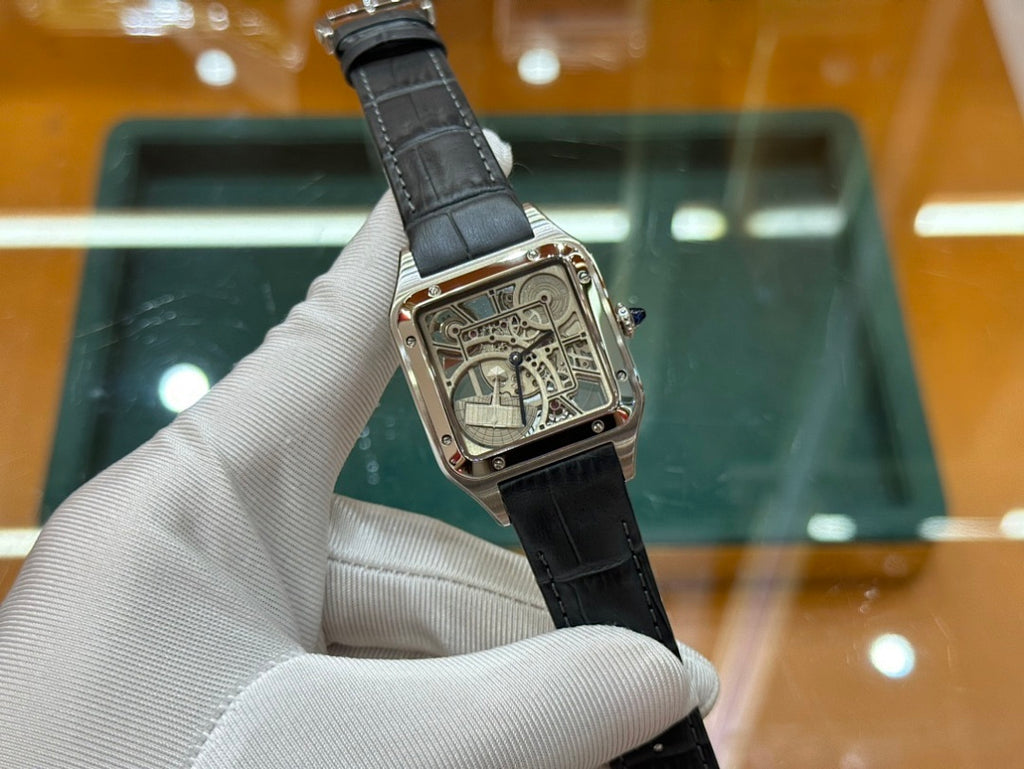 Rectangular skeleton dial wristwatch on black leather strap, angled front view