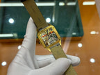 Cartier rectangular wristwatch on black leather strap, gold-tone case and dial