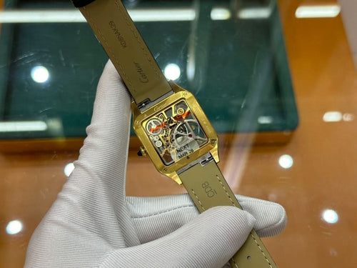 Cartier rectangular wristwatch on black leather strap, gold-tone case and dial