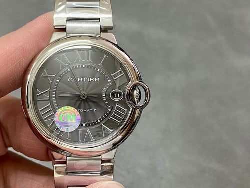 Cartier automatic wristwatch with stainless steel band, gray dial and crown detail at 3 o'clock