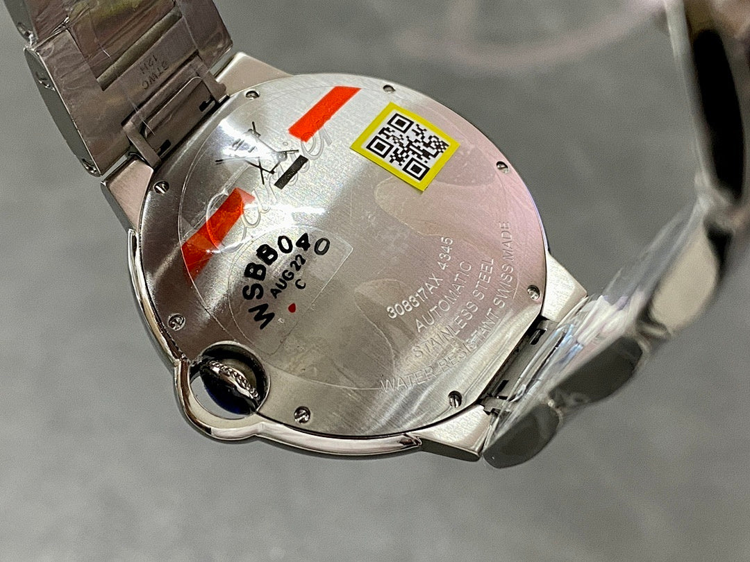 Cartier automatic wristwatch case back with metal surface, markings, and serial label