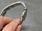Cartier automatic wristwatch stainless steel bracelet link detail view