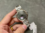 Cartier automatic wristwatch with stainless steel bracelet, gray dial and crown at right