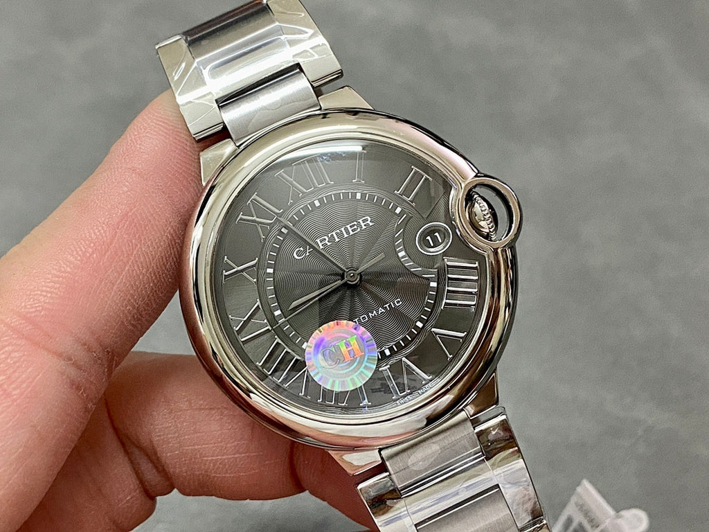Cartier automatic wristwatch front view, stainless steel bezel and gray Roman numeral dial