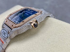 Square automatic watch with blue dial, diamond-studded bezel, side crown view