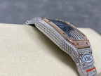 Square watch with blue dial and diamond bezel, bracelet shown from angled side