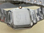 Cartier watch caseback with engraved text and gem accents on metal bracelet