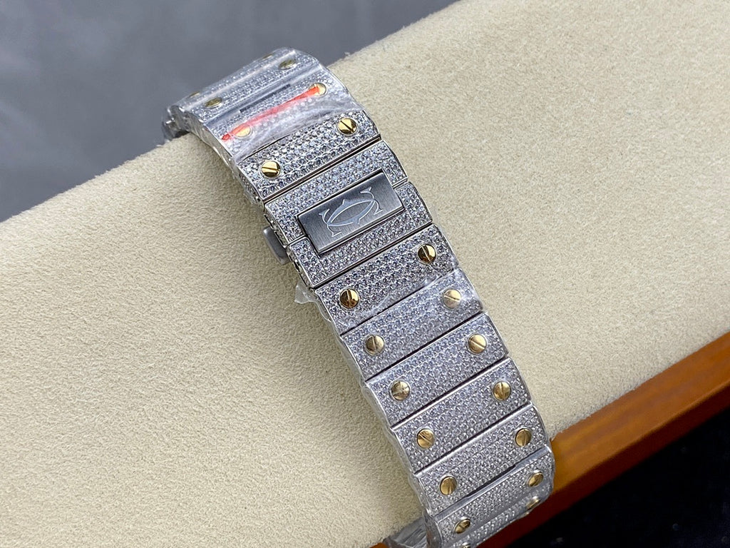 Cartier watch with gray jeweled strap, gold-toned rectangular case, side angle
